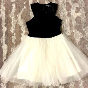Miss Behave girls party dress with black satin, leatherette and tule.